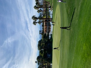Golfers on the green at Bermuda Dunes
